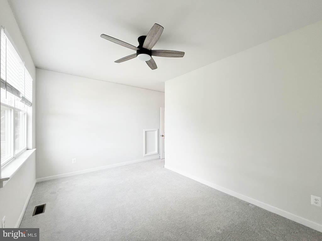9213 Moldova Road Chesterfield, VA 23832 - Photo 30 of 51 a view of empty room with wooden floor and fan