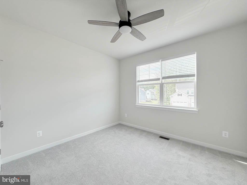 9213 Moldova Road Chesterfield, VA 23832 - Photo 32 of 51 an empty room with a window and a fan