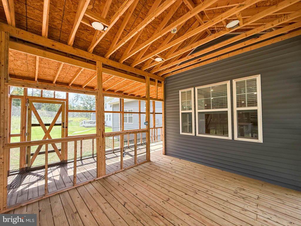9213 Moldova Road Chesterfield, VA 23832 - Photo 48 of 51 a view of empty room with wooden floor and windows