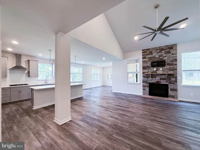 a view of kitchen with cabinets and wooden floor