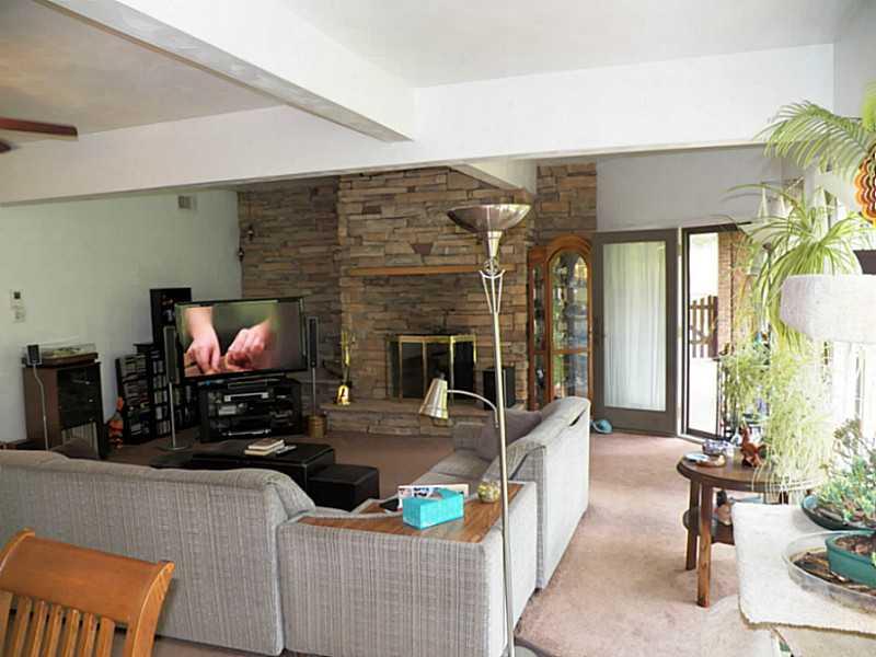 1665 Beighley Road Apollo, PA 15613 - Photo 8 of 20 Living Room. Open floor plan makes these rooms nice & large! Gorgeous stoned wood burning fireplace is the focal point of this home and just in time for comfy cozy cooler nights to come.