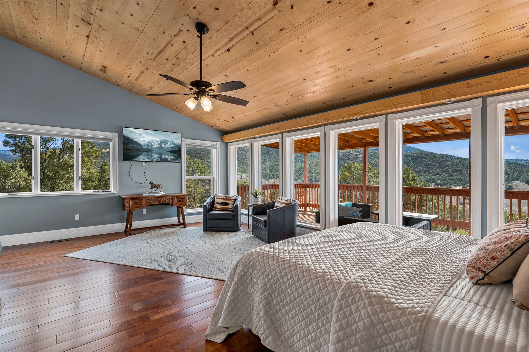1661 Cerro Gordo Road, Unit E Santa Fe, NM 87501 - Photo 11 of 50 Primary bedroom with views of Picacho Peak and Santa Fe River Valley