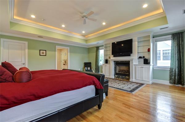 86 McCarthy Road Newton, MA 02459 - Photo 16 of 29 a bedroom with a bed a flat screen tv and dresser