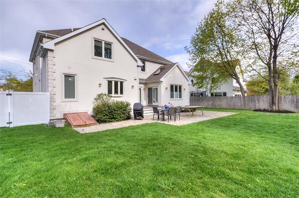 86 McCarthy Road Newton, MA 02459 - Photo 26 of 29 a front view of house with yard and outdoor seating