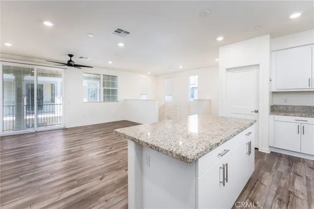 a view of kitchen with wooden floor and window
