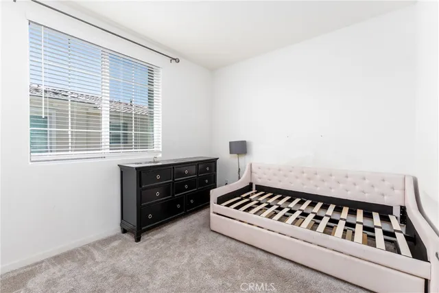 a room with a bed and a window