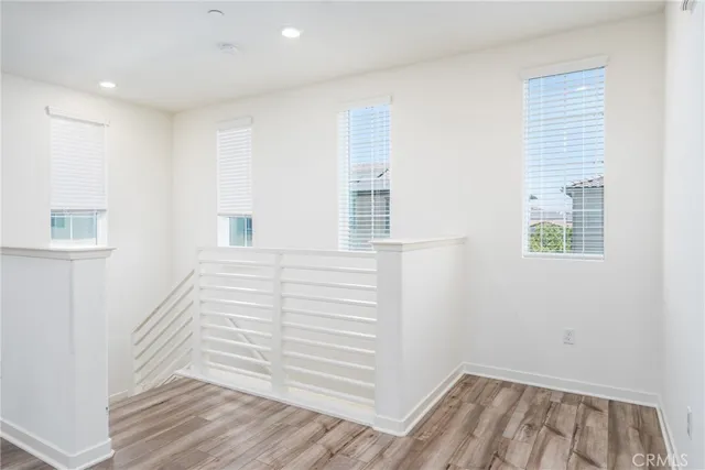a view of a kitchen with a sink and a refrigerator
