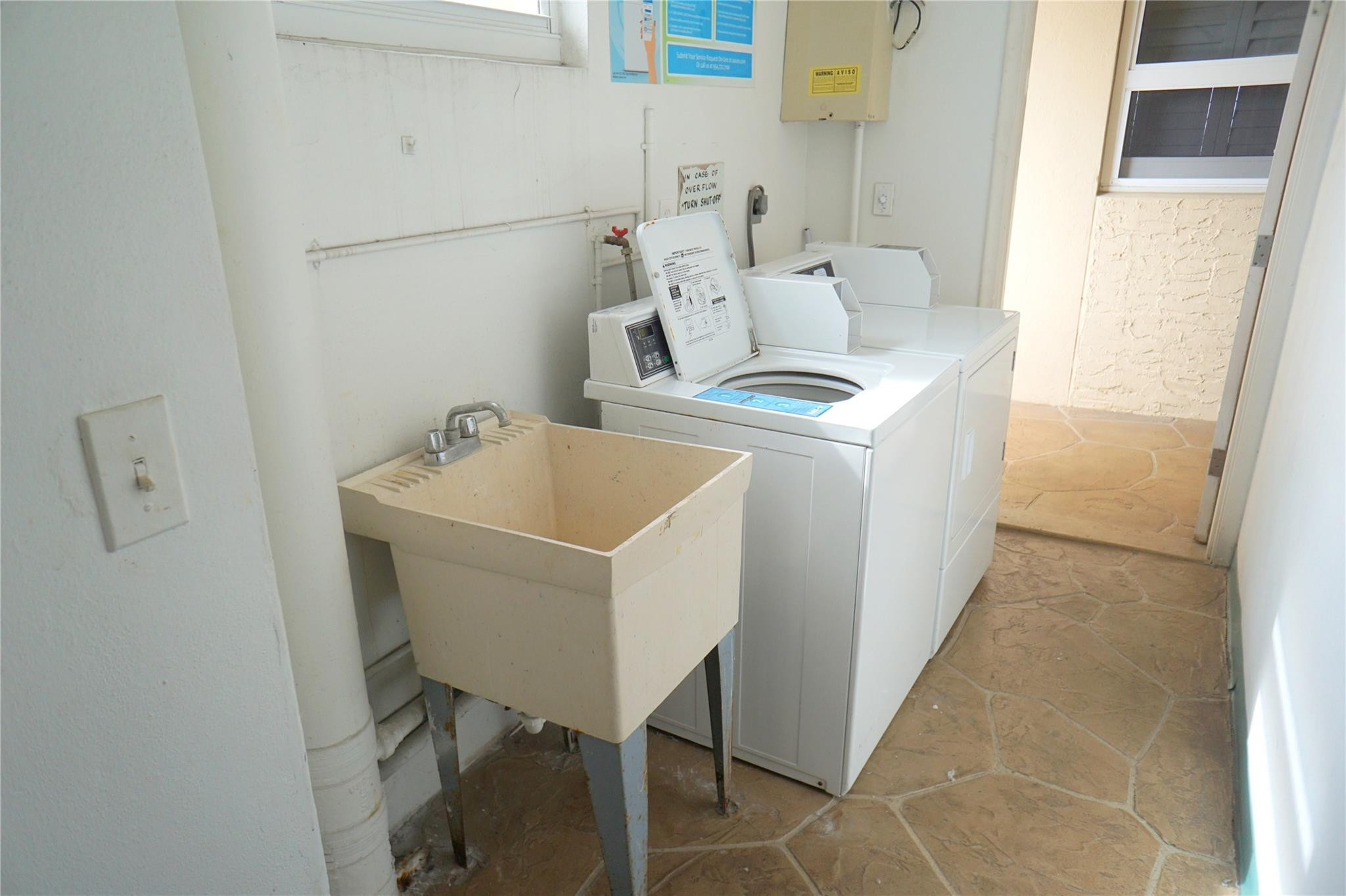 303 North Riverside Drive, Unit PH4 Pompano Beach, FL 33062 - Photo 41 of 52 a utility room with dryer and washer