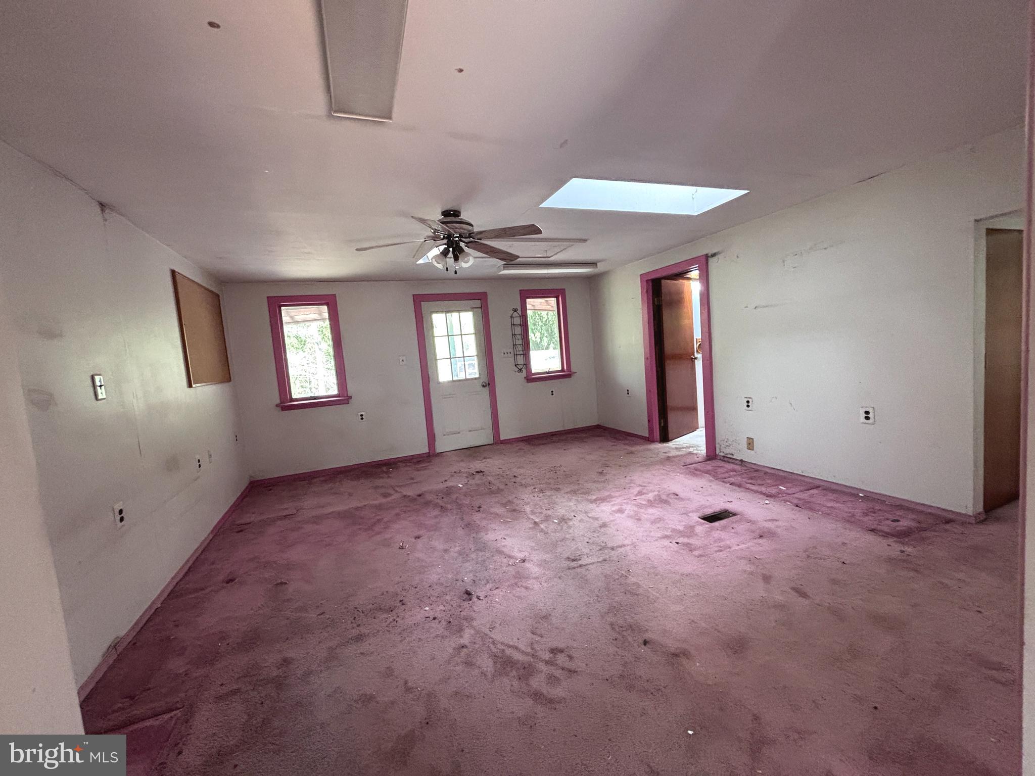 33 Paducah Road Mount Holly, NJ 08060 - Photo 8 of 21 an empty room with windows and chandelier fan