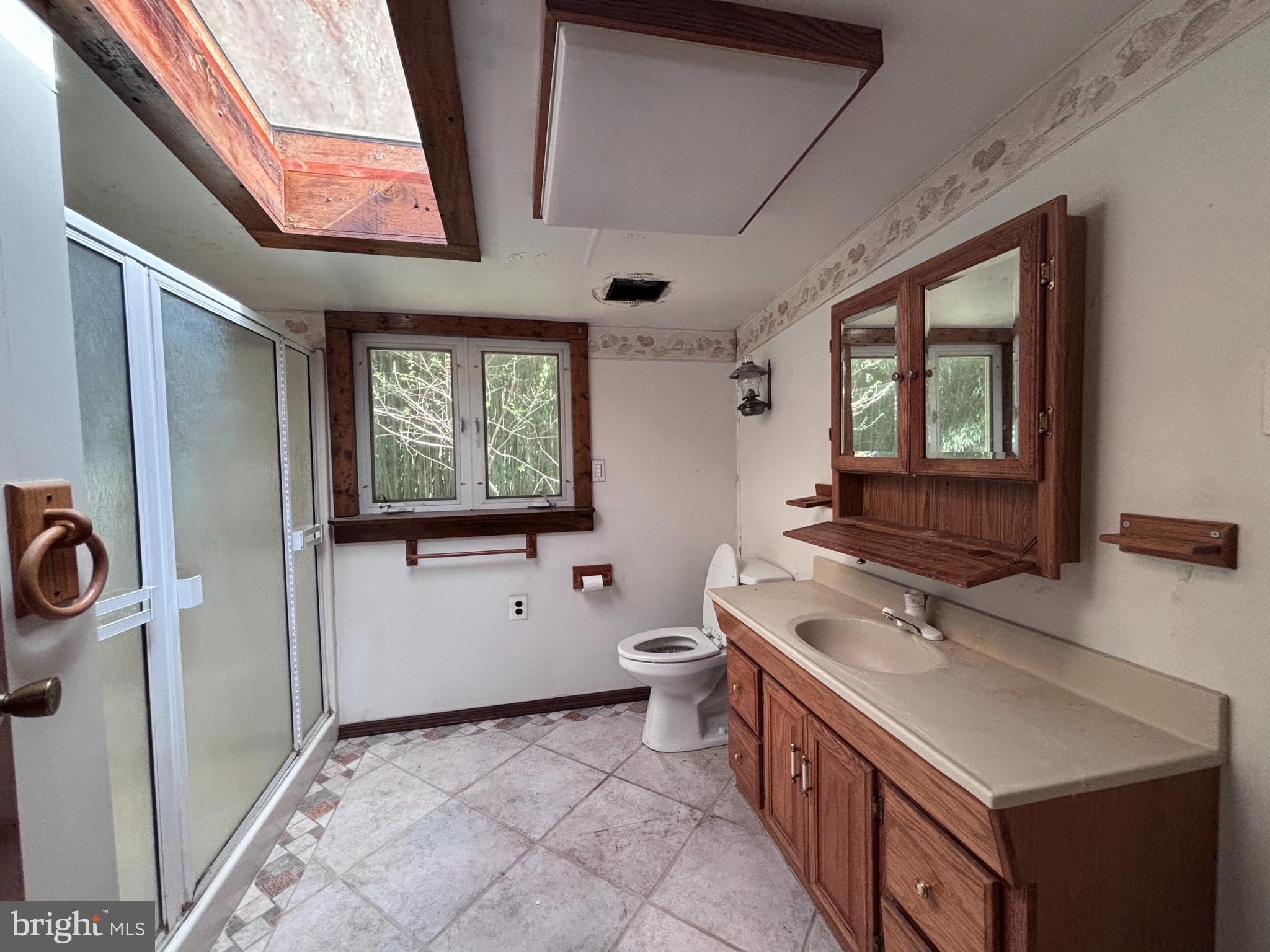 33 Paducah Road Mount Holly, NJ 08060 - Photo 9 of 21 a bathroom with a sink a toilet and mirror