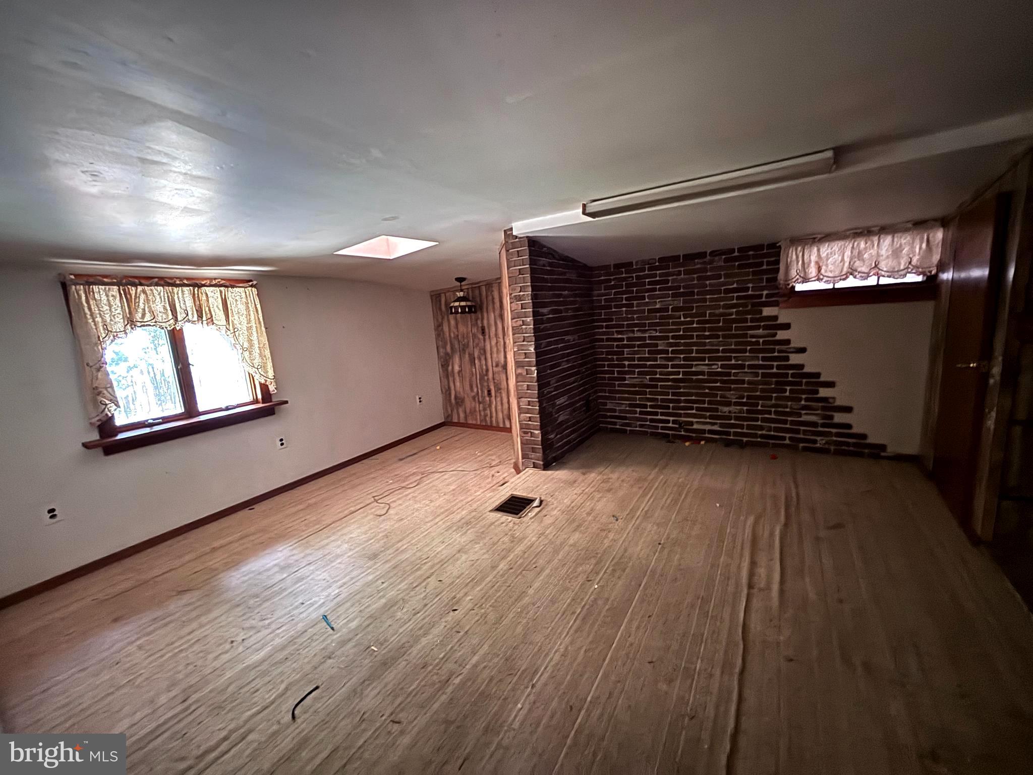33 Paducah Road Mount Holly, NJ 08060 - Photo 10 of 21 wooden floor in an empty room with a window