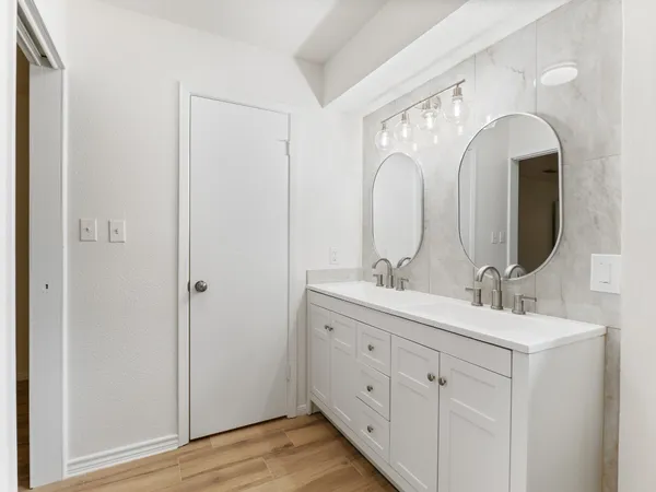 a view of an empty room with a fan