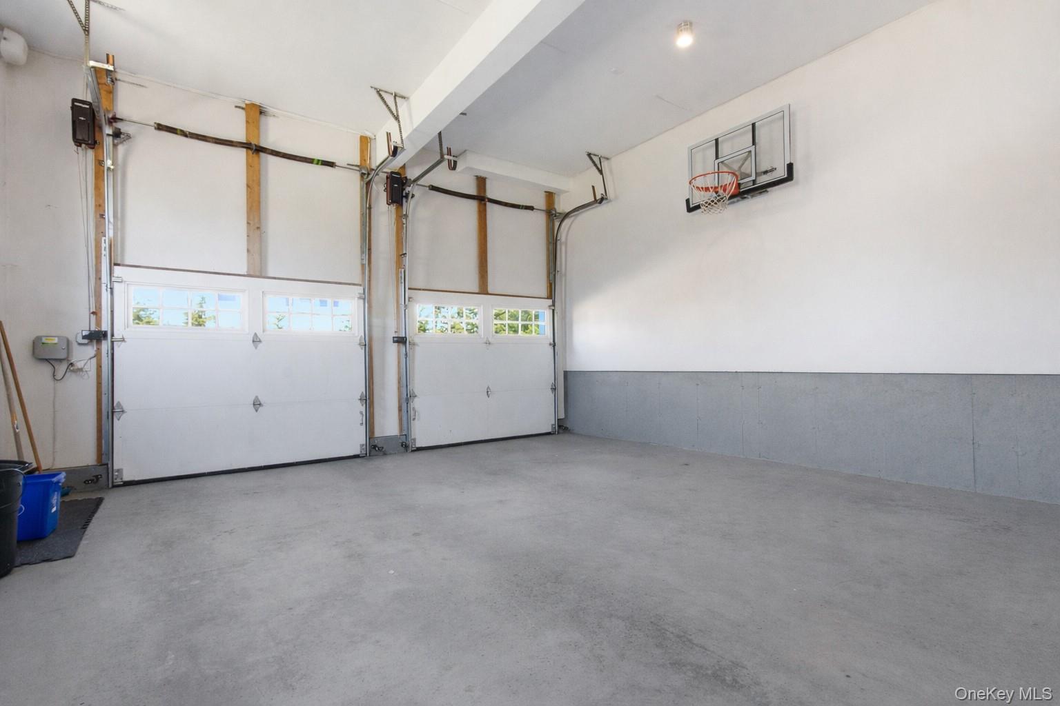 4 Johnson Place Rye, NY 10580 - Photo 37 of 44 2 car garage, regulation height (10’) with indoor basketball hoop
