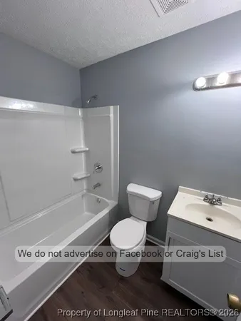 a bathroom with a toilet a sink and a bathtub