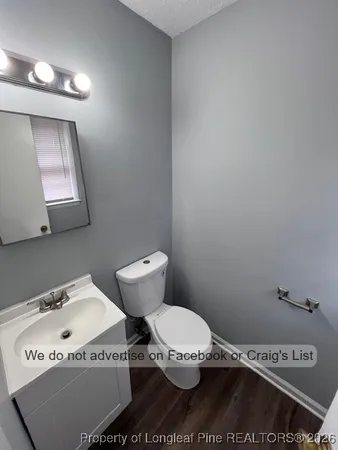 a bathroom with a toilet and a sink