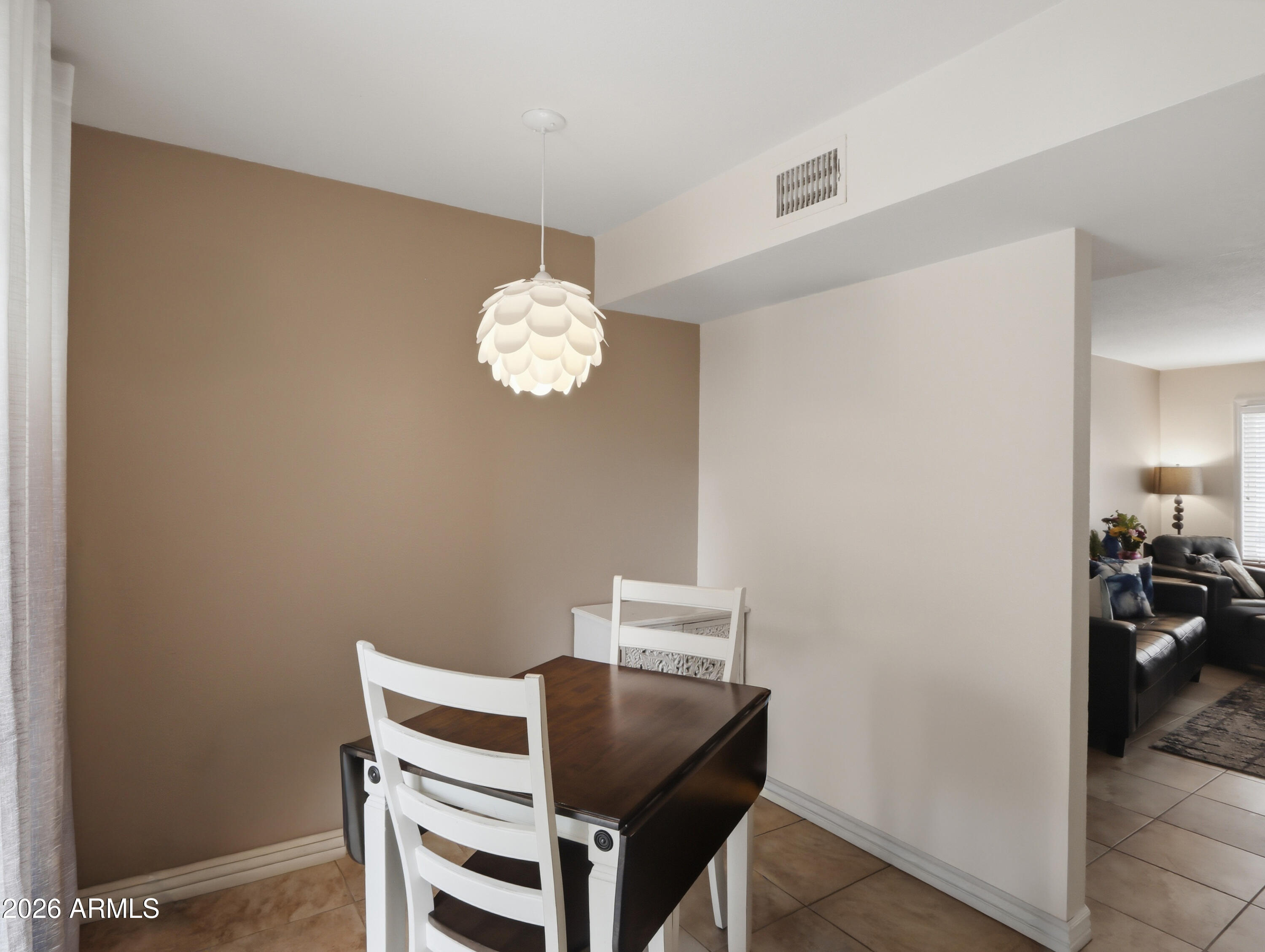 1402 East Osborn Road, Unit 2 Phoenix, AZ 85014 - Photo 8 of 29 a view of a dining room with a table and chairs