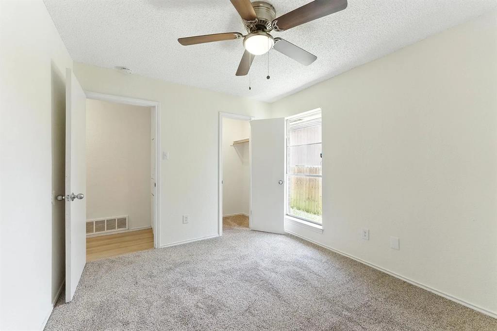 6907 West Cleburne Road Fort Worth, TX 76133 - Photo 11 of 14 a view of an empty room with a window