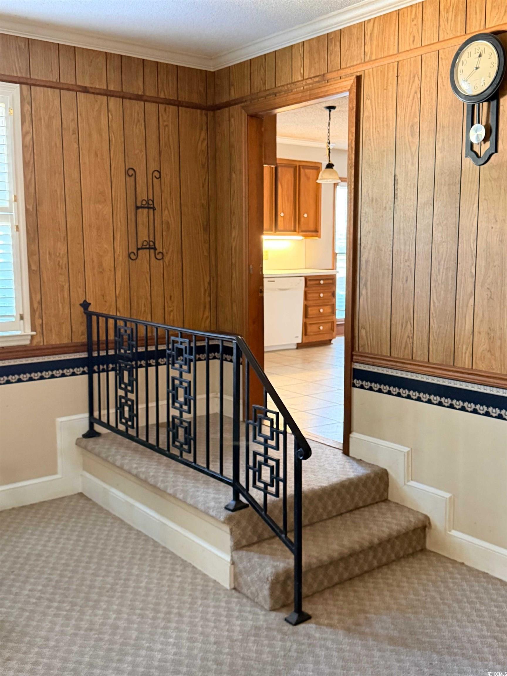 1320 Horseshoe Road Mullins, SC 29574 - Photo 21 of 22 Kitchen with a textured ceiling, brown cabinets, light countertops, beam ceiling, and light tile patterned floors
