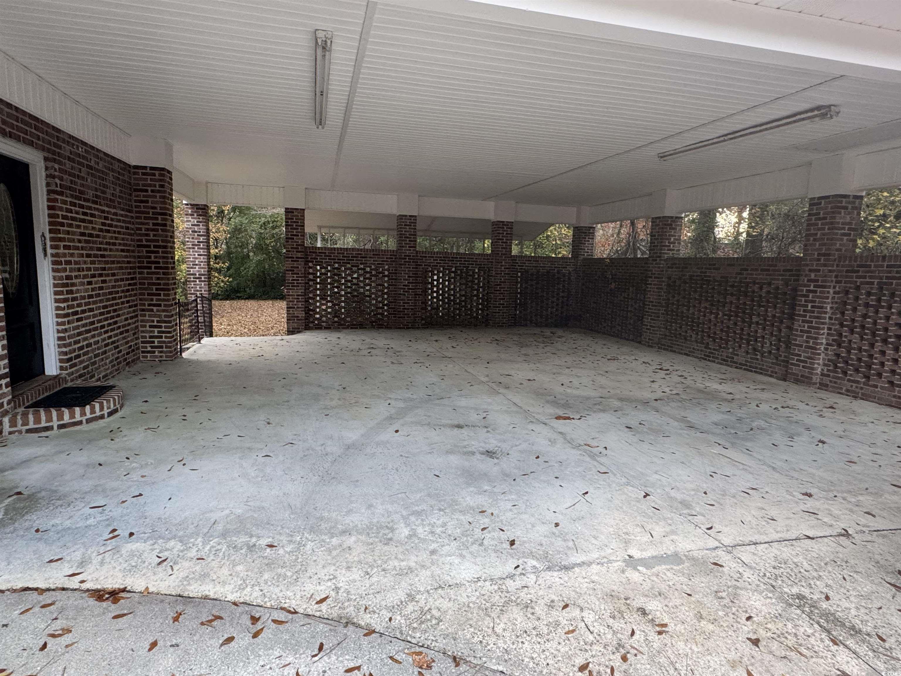 1320 Horseshoe Road Mullins, SC 29574 - Photo 22 of 22 Carpeted empty room with a textured ceiling and a ceiling fan