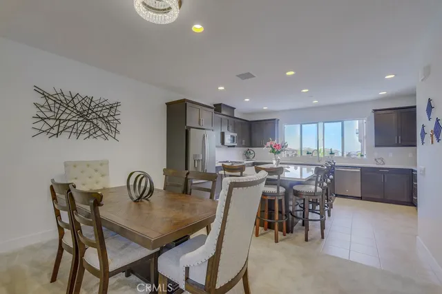 a bathroom with a granite countertop sink a mirror and toilet