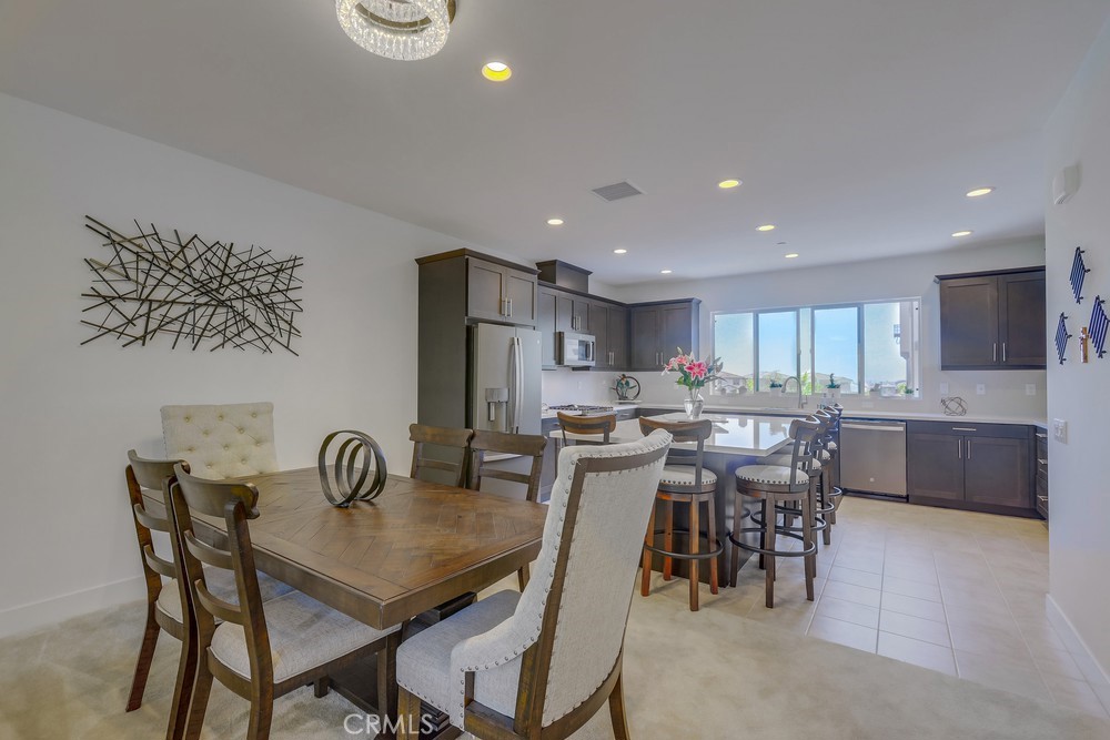 104 Alder Ridge Lake Forest, CA 92610 - Photo 12 of 74 a view of a dining room with furniture
