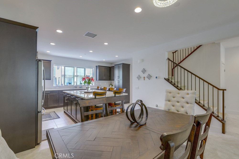 104 Alder Ridge Lake Forest, CA 92610 - Photo 13 of 74 a view of a dining room with furniture window and wooden floor