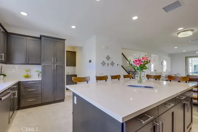 a view of staircase with railing and white walls