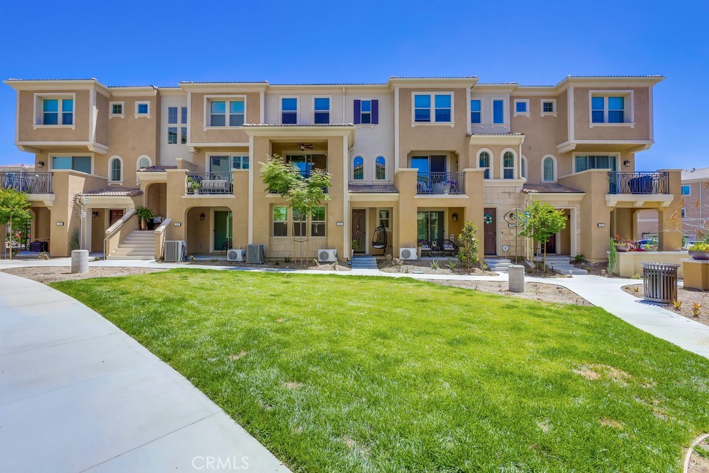 104 Alder Ridge Lake Forest, CA 92610 - Photo 2 of 74 a view of a building with a yard table and chairs
