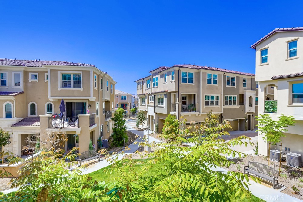 104 Alder Ridge Lake Forest, CA 92610 - Photo 25 of 74 a front view of a house with a yard
