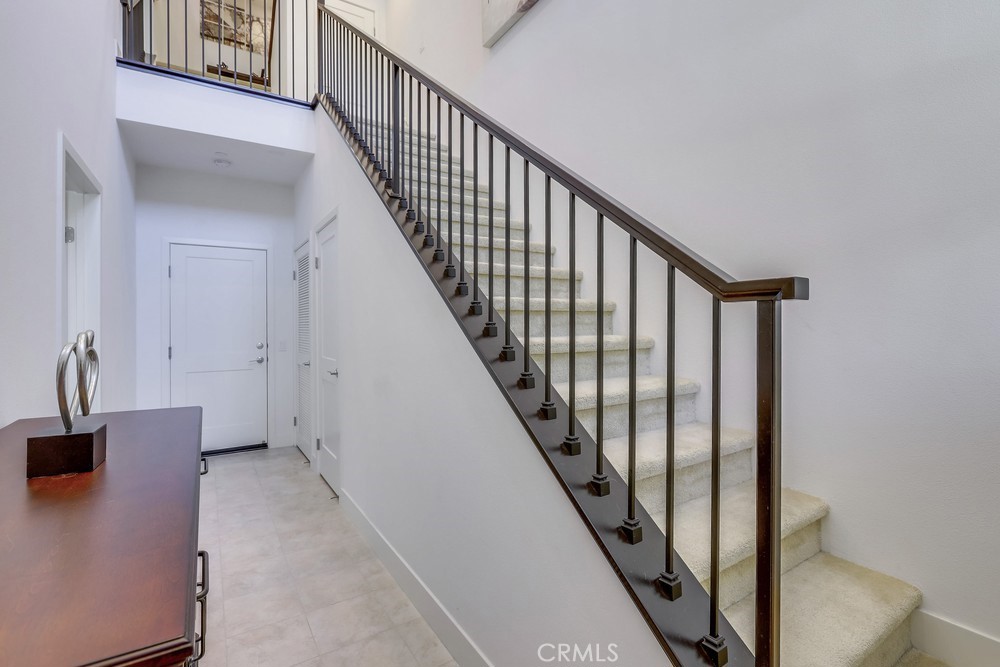 104 Alder Ridge Lake Forest, CA 92610 - Photo 28 of 74 a view of staircase with railing and white walls
