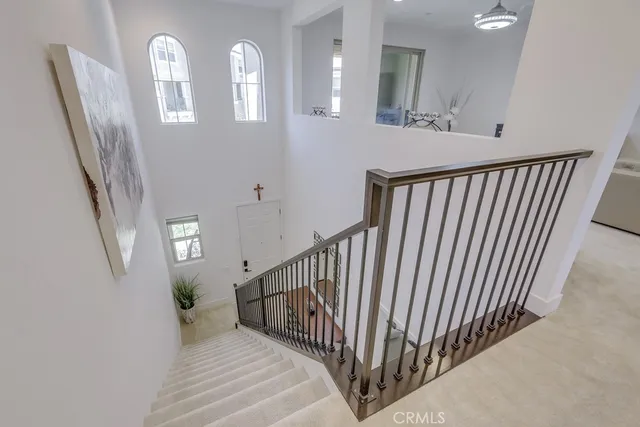 a bedroom with a bed and a night stand