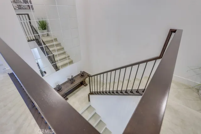 a bathroom with a sink a toilet a shower and a mirror