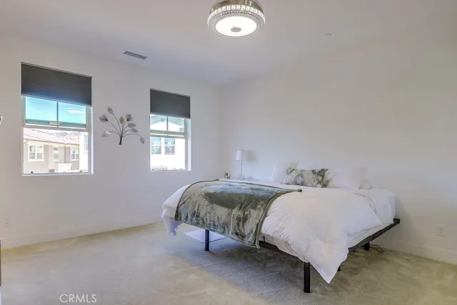 a bedroom with furniture and a window