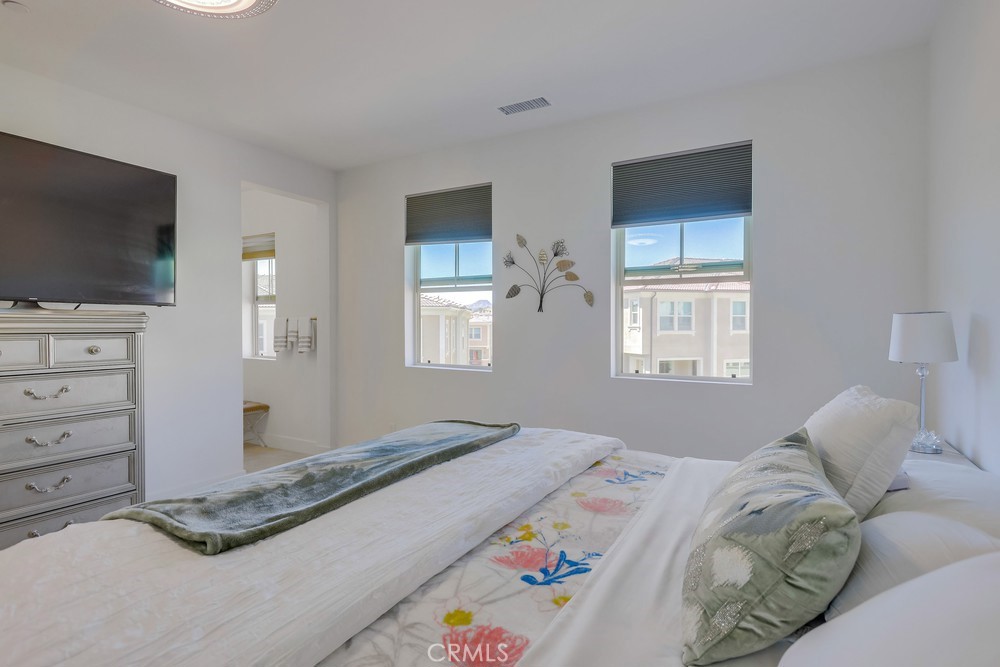 104 Alder Ridge Lake Forest, CA 92610 - Photo 36 of 74 a bedroom with a bed and a flat screen tv