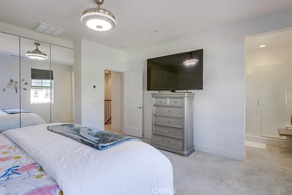 104 Alder Ridge Lake Forest, CA 92610 - Photo 38 of 74 a bedroom with a bed and a flat screen tv