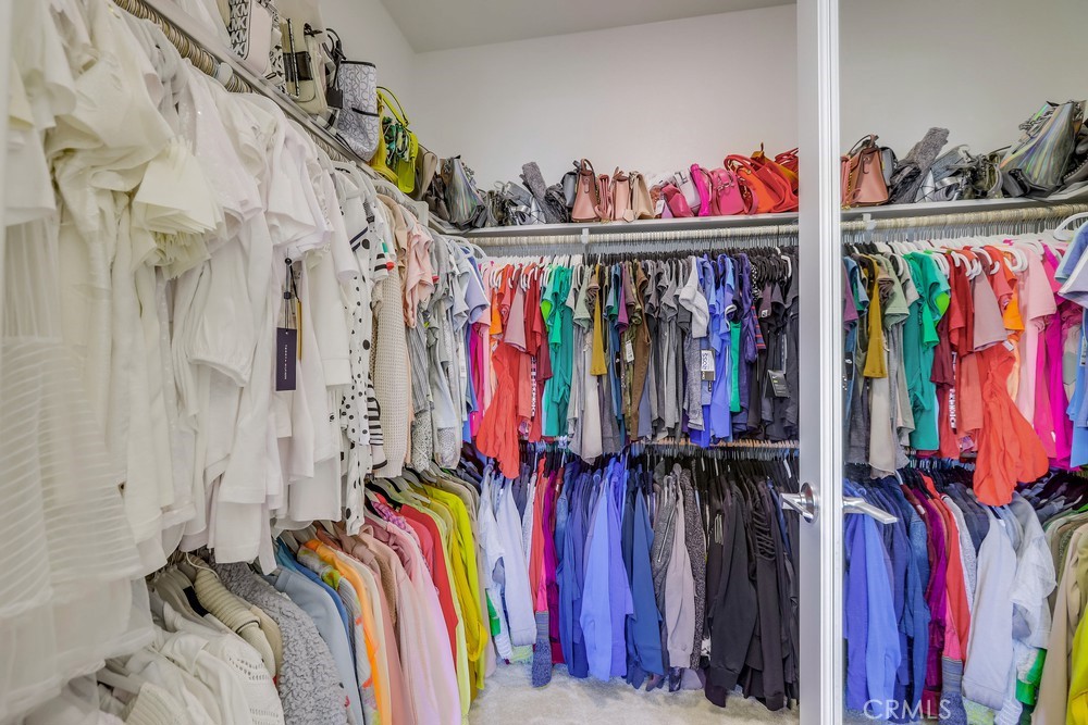104 Alder Ridge Lake Forest, CA 92610 - Photo 42 of 74 a view of walk in closet with clothes