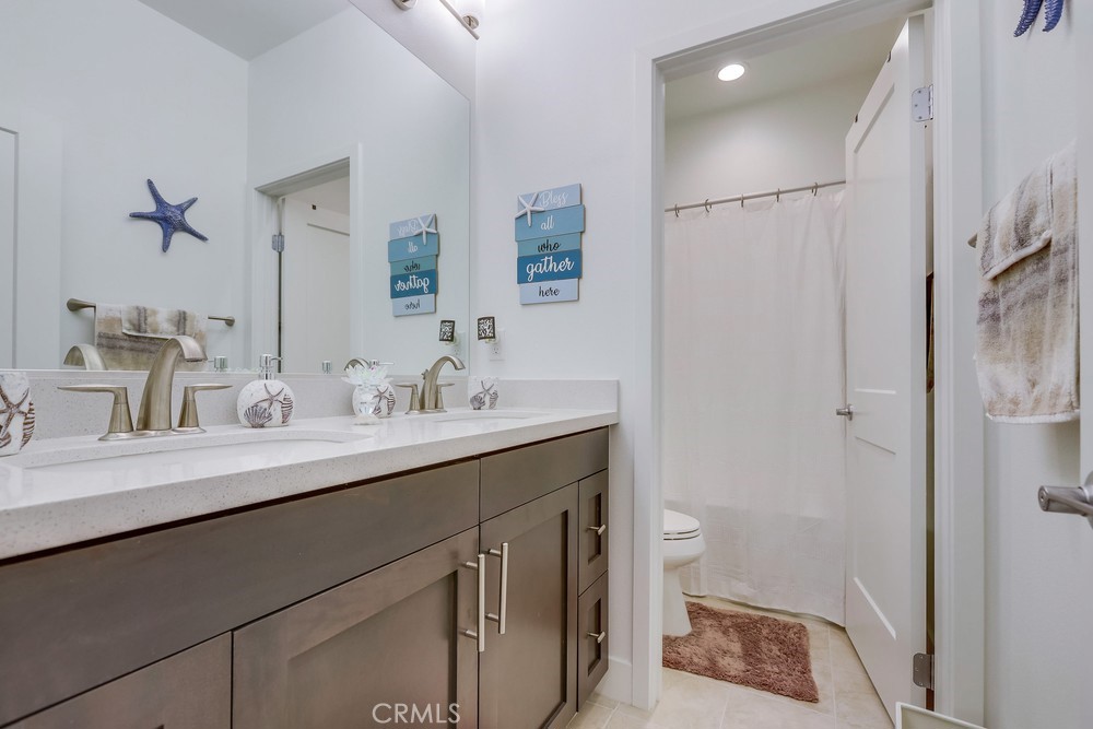 104 Alder Ridge Lake Forest, CA 92610 - Photo 48 of 74 a bathroom with a sink a toilet a shower and a mirror