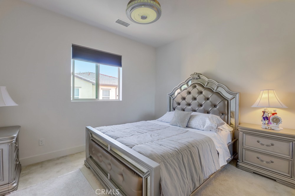 104 Alder Ridge Lake Forest, CA 92610 - Photo 49 of 74 a bedroom with a bed and a window