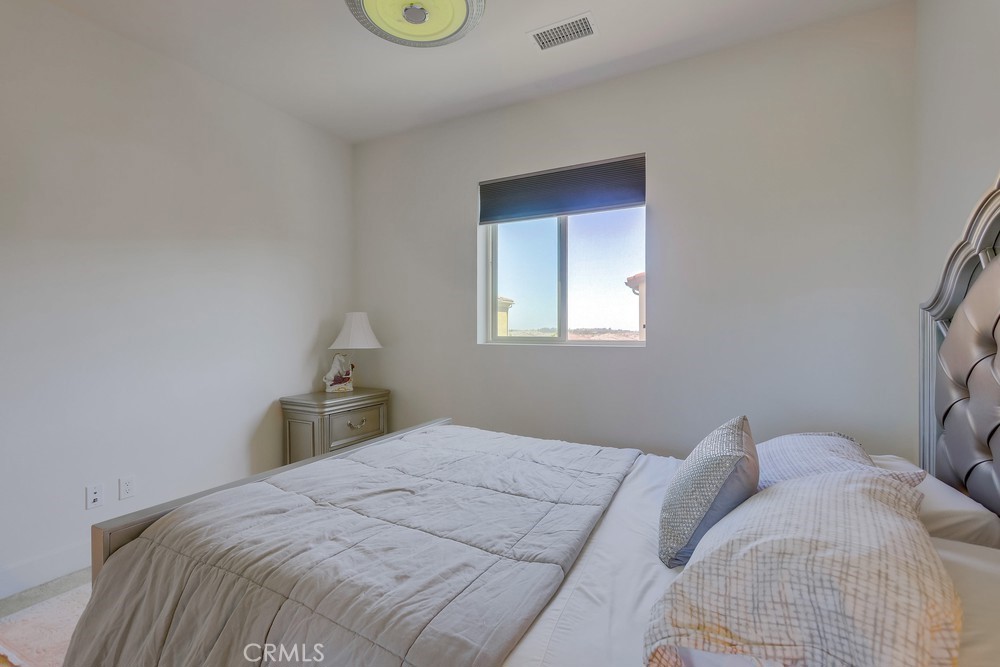 104 Alder Ridge Lake Forest, CA 92610 - Photo 50 of 74 a bedroom with a bed and window