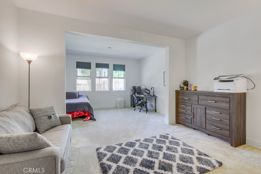 104 Alder Ridge Lake Forest, CA 92610 - Photo 52 of 74 a bedroom with furniture and a window
