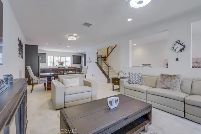 a kitchen with a sink a counter top space cabinets and stainless steel appliances