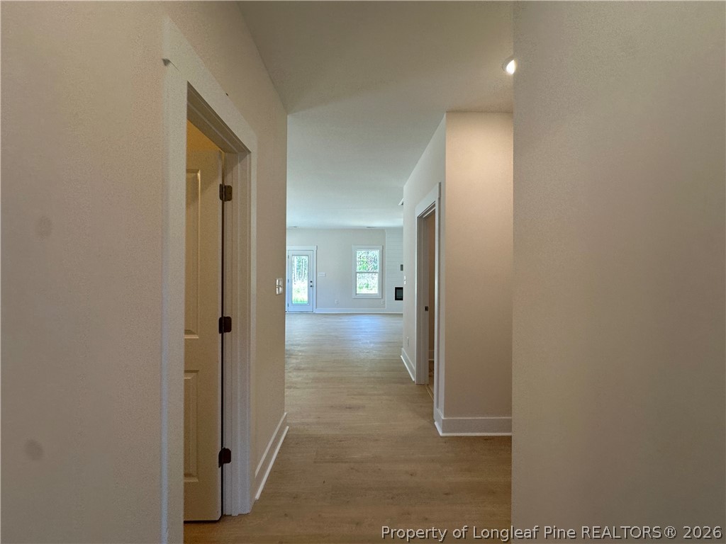 2908 Calloway Road Raeford, NC 28376 - Photo 4 of 25 a view of a hallway with wooden floor