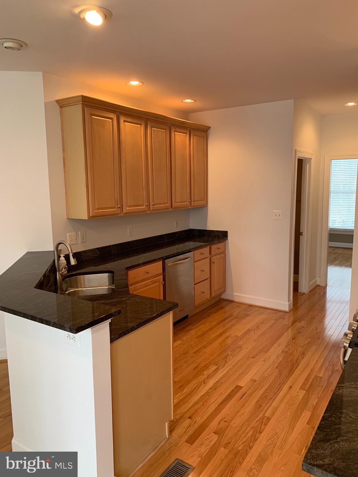 11519 Waterhaven Court Reston, VA 20190 - Photo 6 of 18 Granite countertops and stainless steel appliance