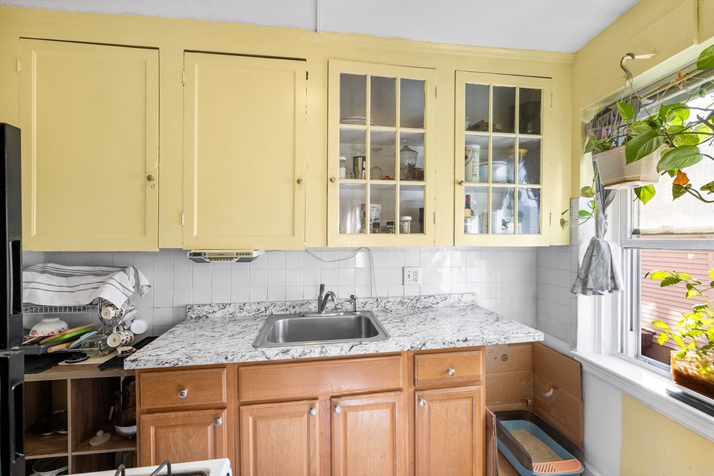 8 Walnut Street, Unit 5 Everett, MA 02149 - Photo 6 of 13 a bathroom with a granite countertop sink and a mirror
