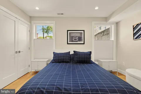 a living room with a couch and a rug