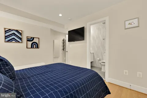 a bedroom with bed and a window