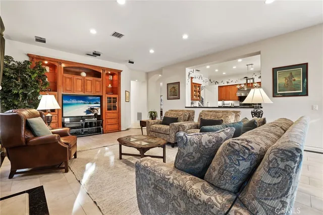 a room with pool table and windows