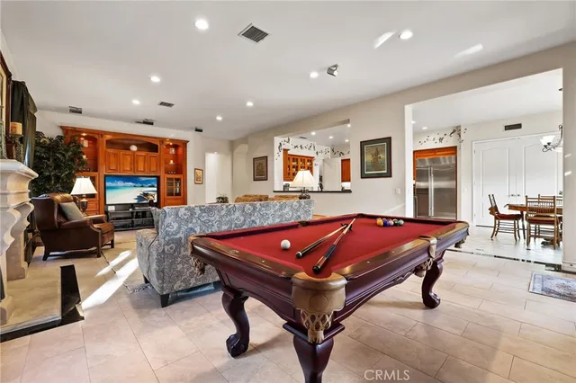 a kitchen with stainless steel appliances granite countertop a stove and a refrigerator