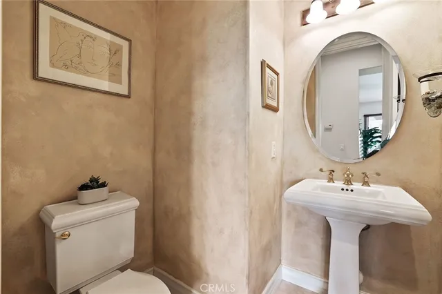 a bedroom with furniture and a large window