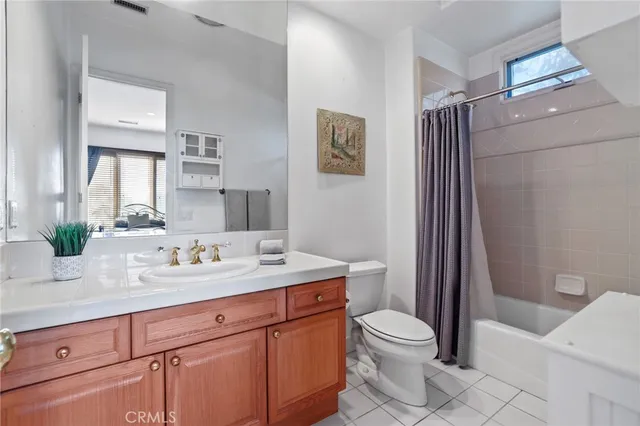 a spacious bathroom with a tub sink shower and mirror